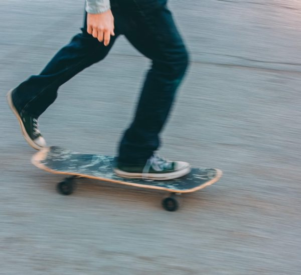 person in black pants riding skateboard